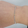 18k vitguld armband med guld detaljer