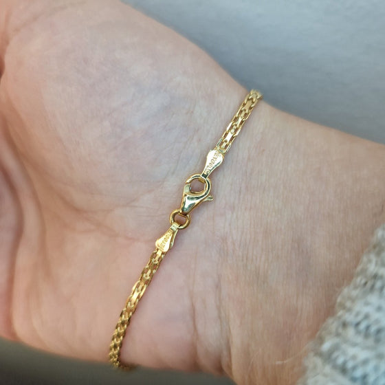 Armband x-länk 18k guld tunn modell utan stav