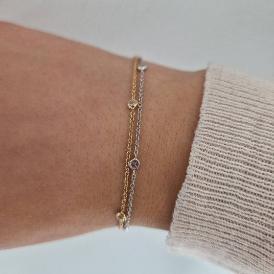 Armband två rader med stenar tvåfärgat 18k guld